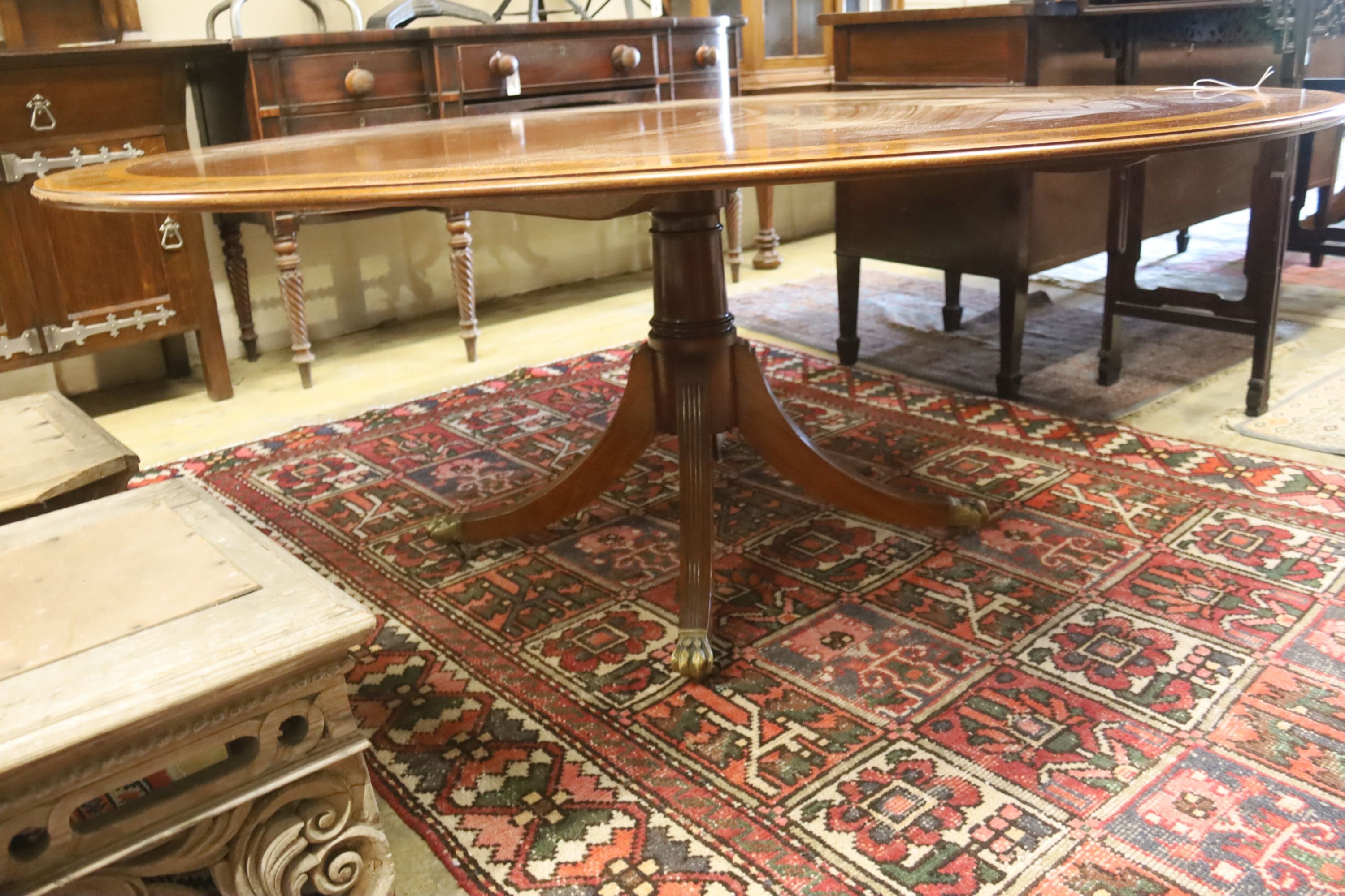 A William Tillman style satinwood banded circular mahogany breakfast table, diameter 184cm, height 75cm